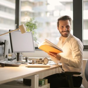 pexels-photo-927022-927022 A relaxed businessman enjoying a break in his bright, contemporary office environment.